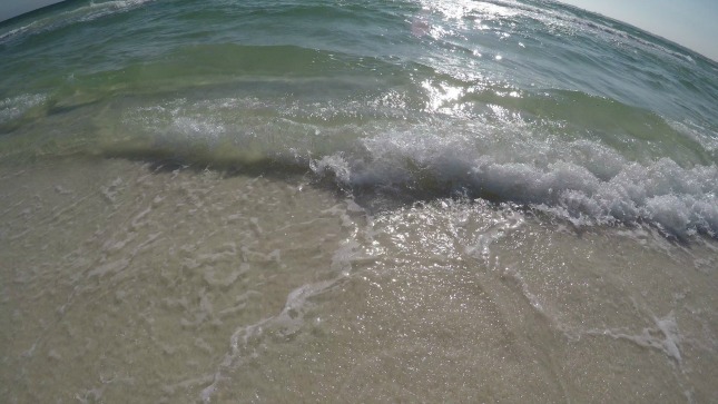 Waves rolling onto beach